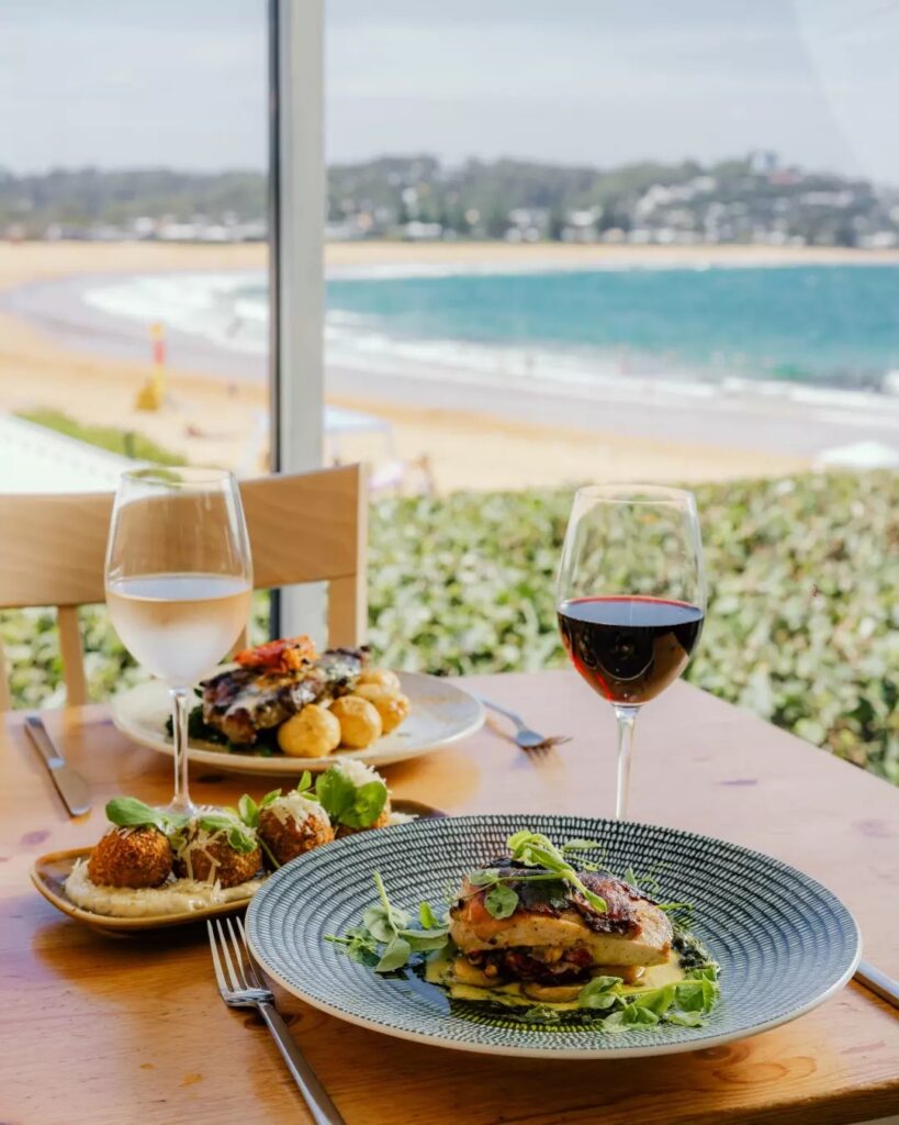Balcony dining at Avoca Beach House with ocean views