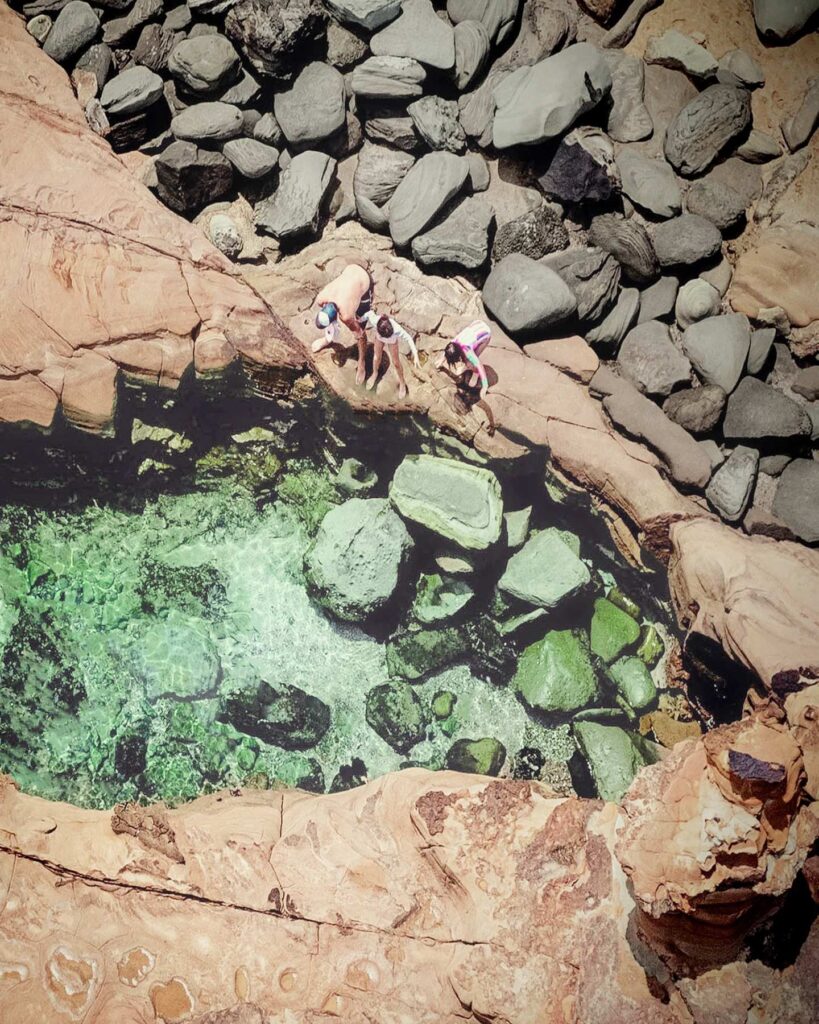 family exploring rock pools at Avoca, kid-friendly